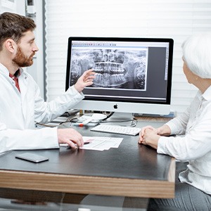 Woman listening to dentist during consultation
