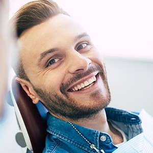 Man smiling at dentist in treatment chair