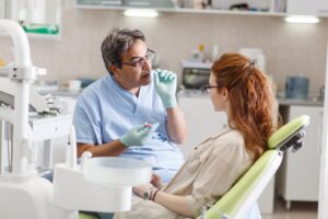 Dentist and patient talking.